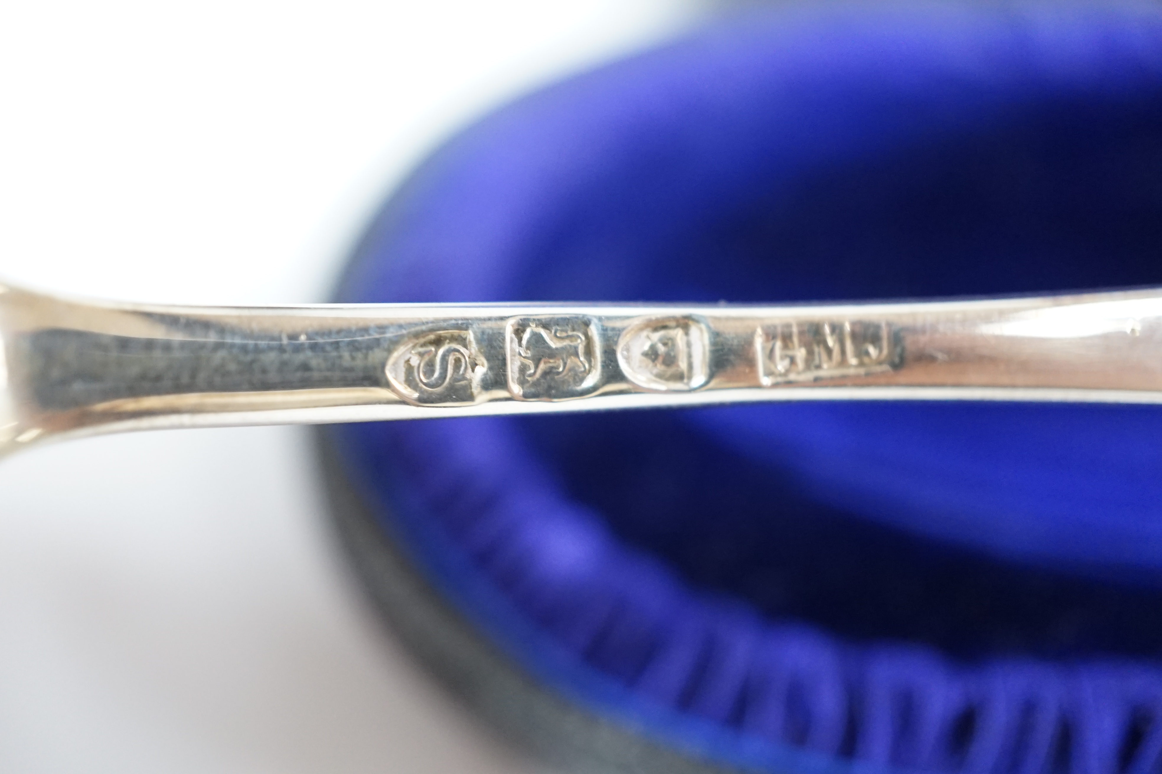 A cased Russian 84 zolotnik spoon, 16.8cm and a cased Victorian silver dessert spoon, London, 1893. Condition - fair to good